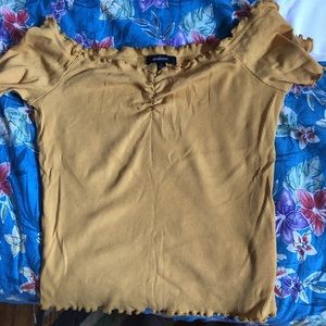A cute yellow off the shoulder shirt